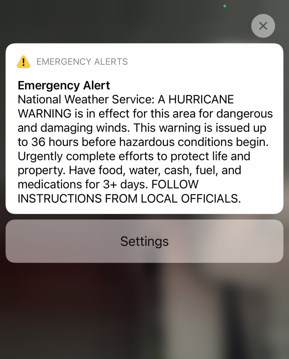 Hurricane Season: Why don't they just leave? Image of phone emergency alert.